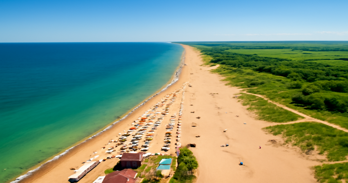Aerial view comparing курортов Черного и Азовского морей, showcasing vibrant beaches and clear skies.