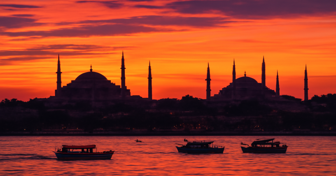 Stunning view of Istanbul's skyline featuring Hagia Sophia and the Blue Mosque at sunset.